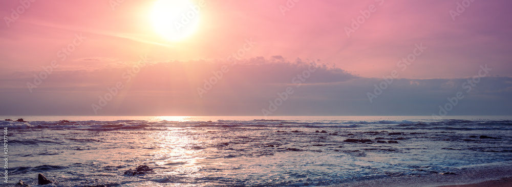 Fototapeta premium Seascape in the evening. Sunset over the sandy beach. Porto, Portugal. Nature landscape