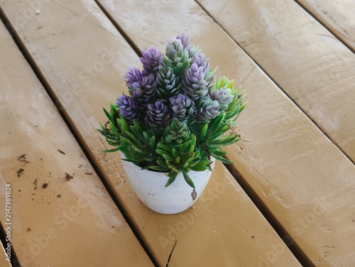 Bild auf Leinwand Artificial flower decorations serve to beautify a room or event in a lasting way, without the hassle of watering or maintenance, and without the risk of wilting