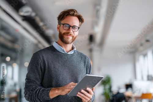 Business professional using digital tablet in modern office