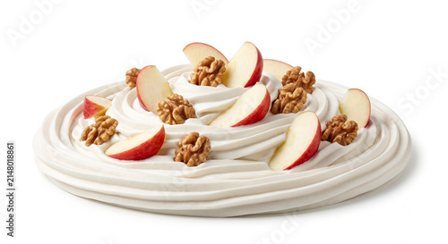 Distant shot of 5 to 10 red apple wedges and walnuts naturally resting on thick white honey cinnamon cream