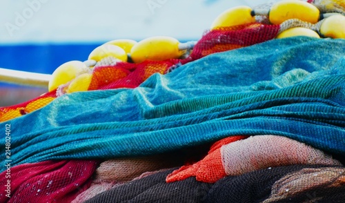 Quadro su tela Fishing nets on the boat by the blue sea in Mediterranean city, nautical equipme