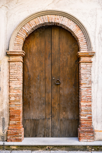 Old wooden door in the little town of Maratea ,Italy