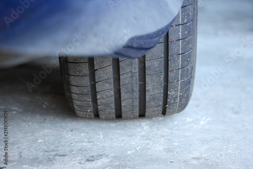 Abstract view of an overinflated new tire