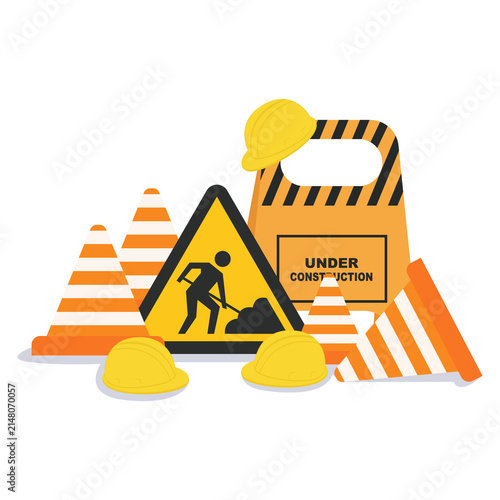 Foto Under construction sign with traffic cones and safety helmets