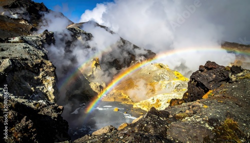 Double Rainbow Arches Over Volcanic Fumaroles and Geothermal Landscape