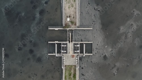 Wastewater treatment plant with aeration basin for sewage sludge processing, environmental engineering, aerial view.