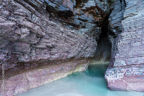 Textured rock formation in the As Catedrais beach or Cathedrals beach in Ribadeo, Lugo, Galicia, Spain.