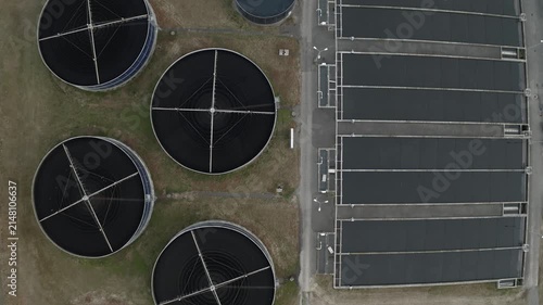 Wastewater treatment plant with circular clarifier tanks, sedimentation, sewage purification and engineering, aerial view.