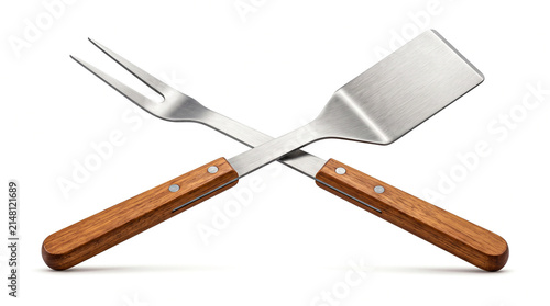 Crossed meat fork and spatula with wooden handles isolated on white background