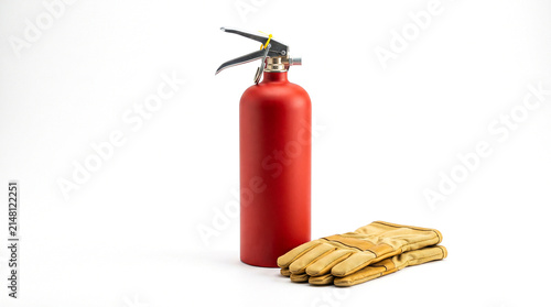 Red fire extinguisher and a pair of work gloves isolated on white background