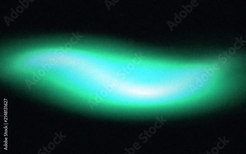 Abstract glowing green light wave form floating in a dark environment creating a soft blurred effect with a bright central illumination spot