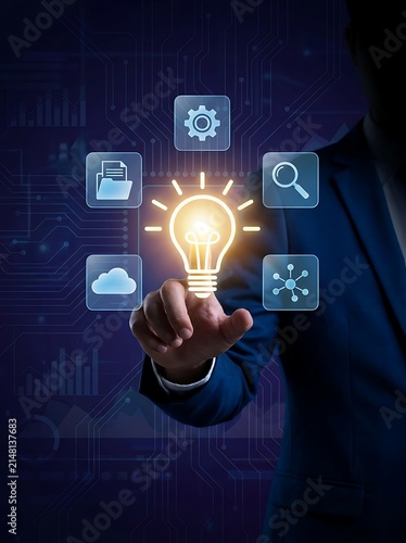 Person's finger touching glowing light bulb with digital