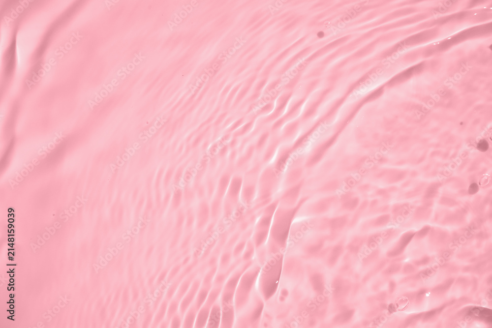 Fototapeta premium Abstract transparent water shadow surface texture natural ripple on pink background