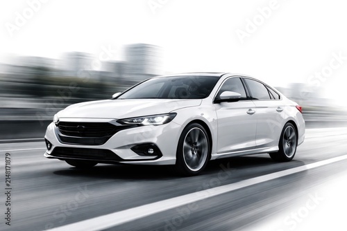 Sleek modern white sedan driving