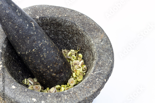 Konstfotografi Traditional heavy granite stone mortar and pestle filled with freshly sliced lem