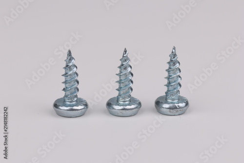 Metal screws for fastening equipment. Soft focus. Close-up. 