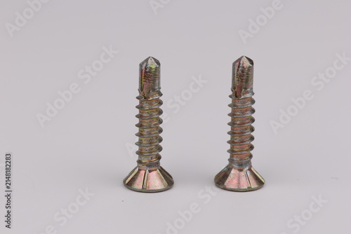 Metal screws for fastening equipment. Soft focus. Close-up. 