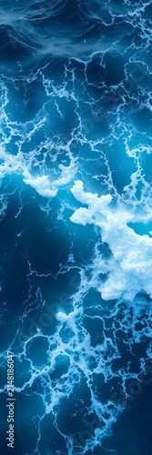 Turbulent ocean surface with a burst of bright blue water and foamy crests forming a dramatic wave shape, water, ||ocean