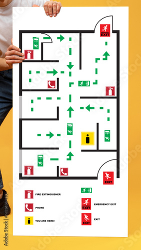 Photography Emergency evacuation plan shows safe routes and exits in a building layout