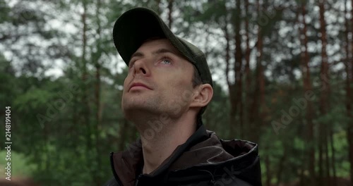 Young hiker exploring wild woods on overcast day close up shot