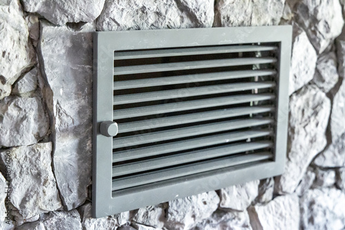 Fotografía Ventilation grille set into a rough stone wall for air circulation