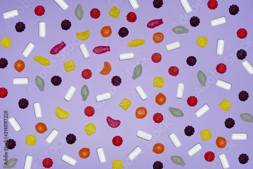 Assorted candy pattern on pastel purple background