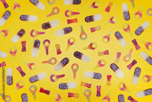 Colorful Sugar Coated Gummy Candy on Yellow Background