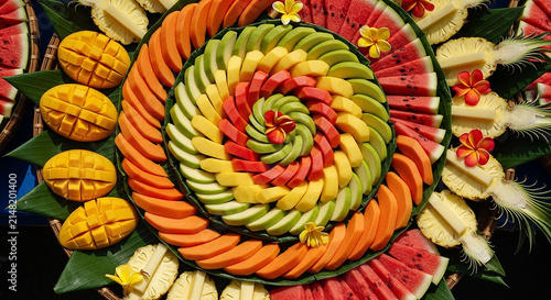 Vibrant Spiral Fruit Platter: Tropical Delights, Healthy Eating, Exotic Display