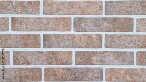 Brown brick wall texture with white mortar joints
