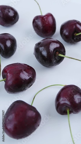 Ripe cherries rotate in closeup. Fruit highlights vibrant color, orchard freshness and premium quality for retail packaging, healthy lifestyle content, seasonal marketing, food presentation. 4k video