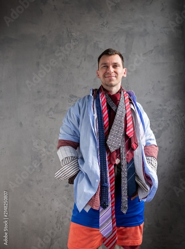 Quadro su tela Funny man in multiple shirts and neckties looking forward