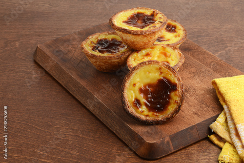 fresh baked Portuguese Custard Tarts Pastel de nata on cutting board