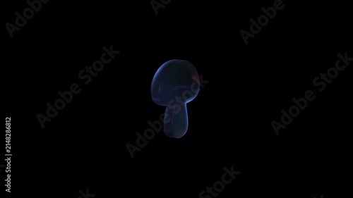 Luminous glass mushroom rotating in darkness