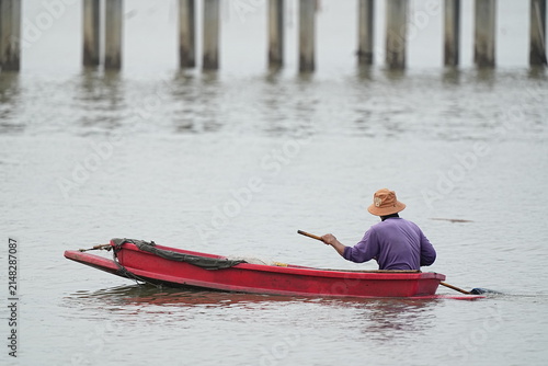 Fishermen are paddling small boats along the coast at Bang Pu District, Samut Prakan Province, Thailand. Photographed on July 30, 2026.