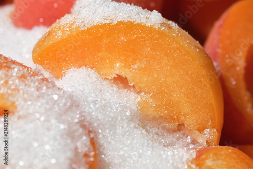 High sugar consumption. Apricots jam making process. Cooking apricot jam with sugar. Shallow depth of field. 