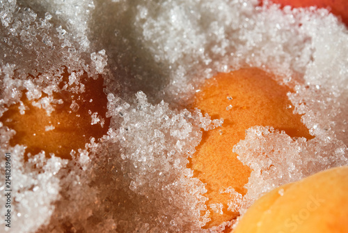 Cooking berries apricot under sugar. Apricots jam making process. Shallow depth of field.