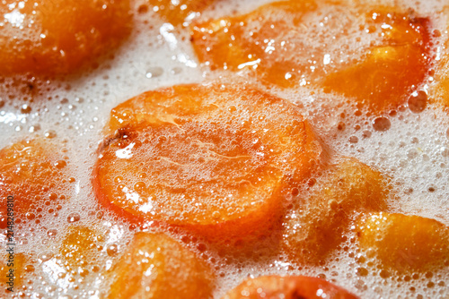Freshly cooked, hot apricot jam. Cooking apricot jam with sugar. Apricots jam making process. Apricot Jam. Shallow depth of field.