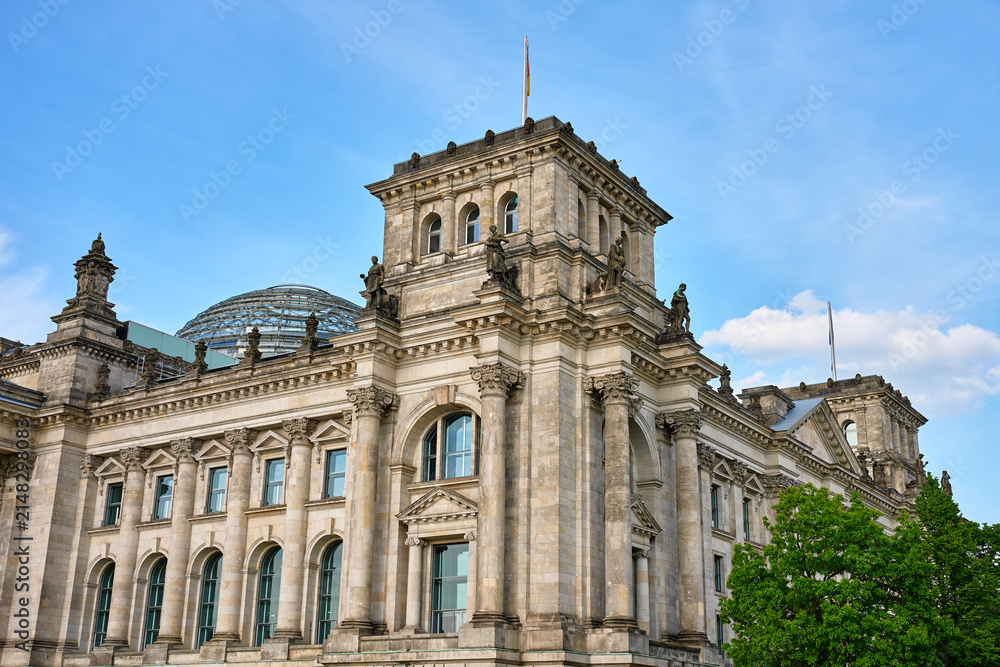 Fototapeta premium Reichstag building with glass dome under blue sky in Berlin