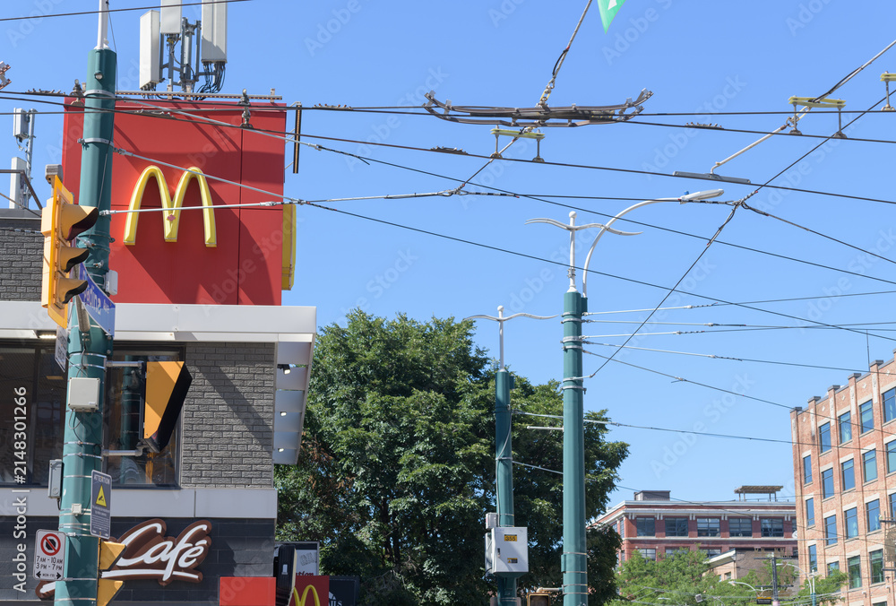 Fototapeta premium exterior building and sign outside McDonald's, a fast food restaurant chain, located here at 160 Spadina Av (northwest corner of Queen St), Toronto