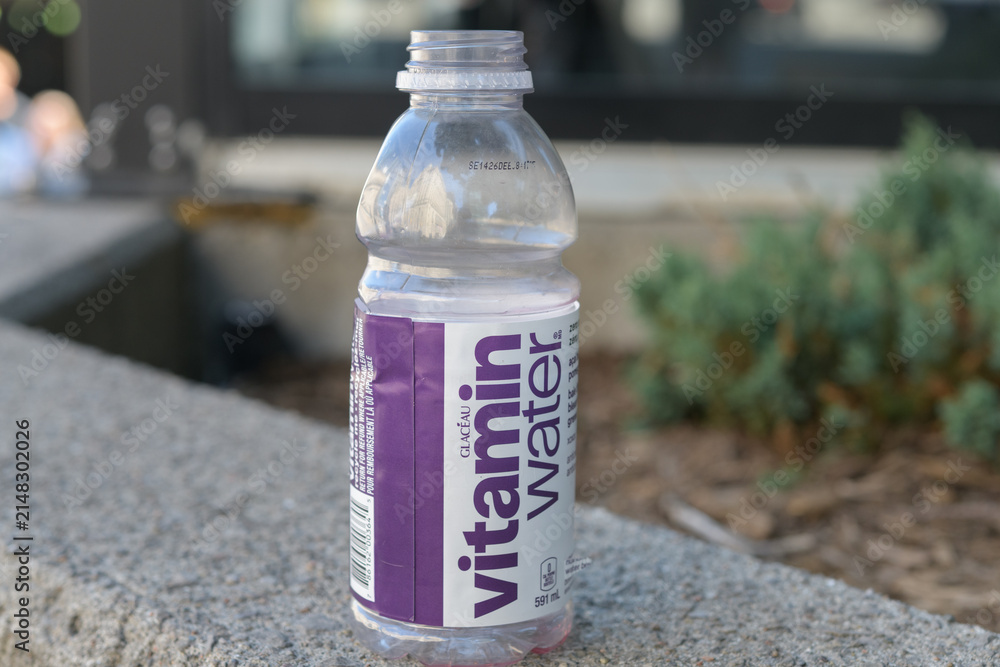 Fototapeta premium empty bottle of Glacéau Vitaminwater (a Coca-Cola brand) with purple and white label, Toronto