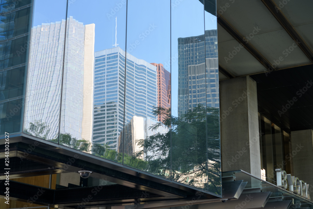 Fototapeta premium abstract and distorted building of Toronto's financial district on the windows of 18 York Street (PwC Tower)
