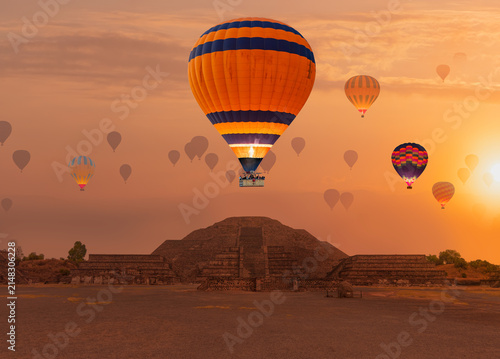 Hot air balloon flying over Teotihuacan pyramids complex located in Mexican Highlands and Mexico Valley close to Mexico City. Mexico