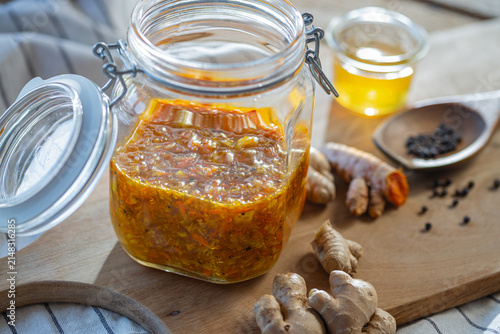 Obraz na płótnie Probiotic healthy ferment with ginger, turmeric, and honey - a home remedy from
