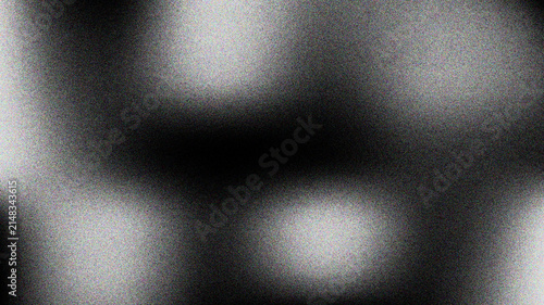 Abstract dark background with diffused light and grainy texture, mysterious ambiance.
