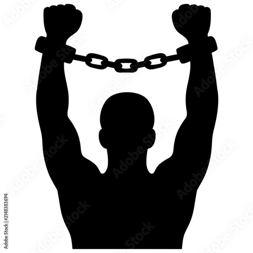 Silhouette of a man with handcuffed hands