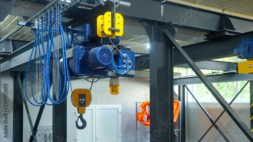 Bild auf Leinwand Electric Wire Rope Hoist and Hook Unit on Overhead Beam