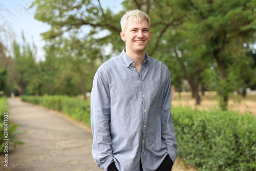 Portrait of smiling man wearing shirt in park