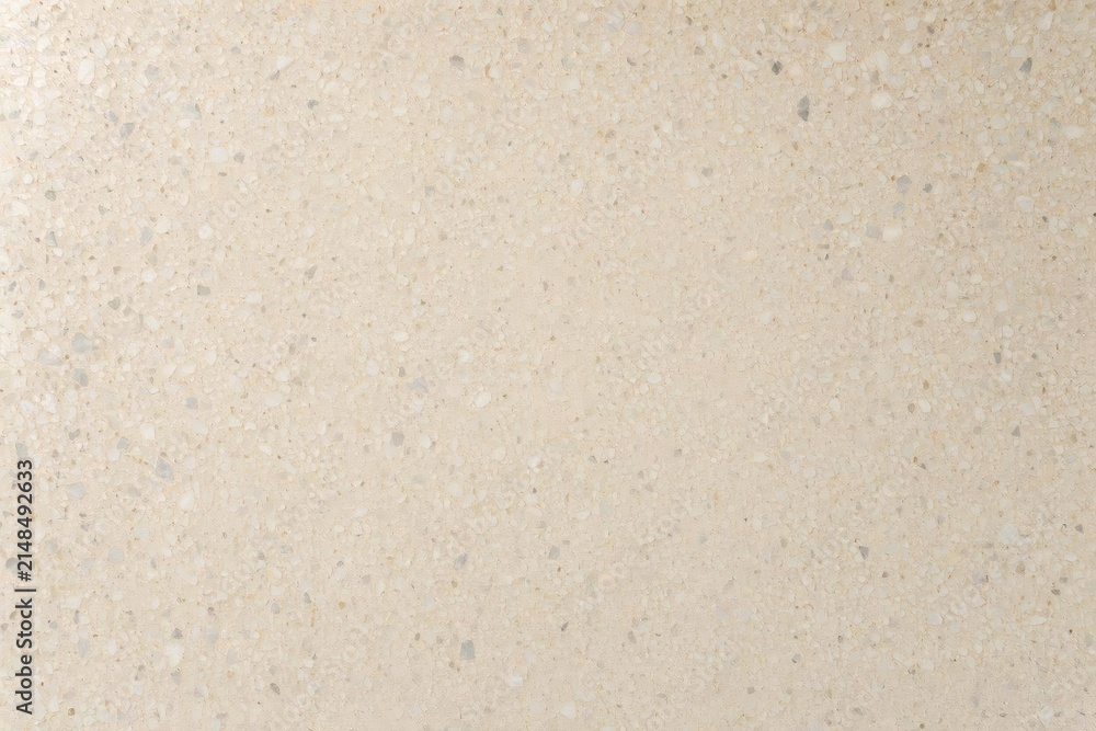 Obraz premium Speckled terrazzo countertop with tactile grain and sheen - Close composition emphasizing micro‑pitting, aggregate edges, and reflective polish of a warm terrazzo surface.