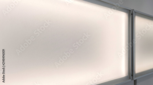 Warm Backlit Frosted Panel with Gray Frame and Copy Space