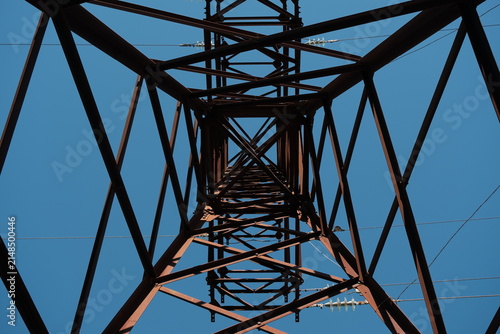 steel lattice support. A lattice steel support is a structural framework of interconnected metal components. A steel lattice support against a blue sky
